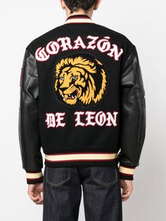 lion-patch sport jacket from Awake NY featuring black, wool blend, calf leather, patch detail, contrasting-fabric sleeves, front button fastening, band collar, long sleeves and lion patch design. Size Info STANDARD Color Detail Black Made In Corea Material Outer: Calf Leather 100%, Wool 80%, Nylon 20% Lining: Polyester 100% Season One Fall-Winter Season Two Fall-Winter Product coats Brand Awake Ny Size And Fit This piece fits true to size. We recommend you get your regular sizeModel is 1,84m / 6 Black Outerwear With Baseball Collar And Logo Patch, Black Baseball Collar Outerwear With Logo Patch, Black Varsity Jacket With Baseball Collar And Logo Patch, Black Varsity Jacket With Logo Patch For Winter, Black Varsity Jacket With Logo Patch For Fall, Black Varsity Jacket With Logo Patch For College, Black Varsity Jacket With Logo Patch, Black Varsity Jacket With Patches, Black Varsity Jacket With Patches For Streetwear