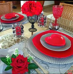 the table is set for valentine's day with red roses