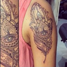 a woman's arm with tattoos on it and an eye in the middle of her arm