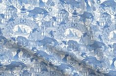 a blue and white fabric with an image of animals on it's back side