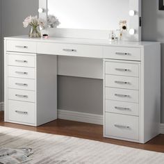 a white desk with drawers and a mirror