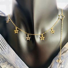 Stars charm choker, long dangle gold necklace, 14K gold filled, Handmade in USA, Gift for her Original well-design makes unique and elegant look. Simple stylish with high quality materials to wear everywhere. Perfect as gift for her. Both raw materials and final products are made in USA. Designed and handmade by Rachel L. About 14k Gold filled metal: 14k is bonded to other metals (sterling silver, copper) and is over 100 times thicker than high quality plated gold. Durable & tarnish resistant, these rings are suitable for daily wear. Filled gold necklaces are beautiful, affordable alternatives to solid gold, and can be worn by people with sensitive skin. Gold Necklaces, Star Charms, Gold Stars, Wellness Design, Solid Gold, Jewelry Necklace Pendant, Gold Filled, Choker, Gift For Her