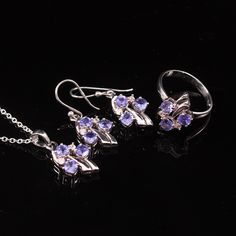 925 Sterling Silver Set Natural Tanzanite Jewelry Set, Bridal Jewelry Set Ring,Earrings,Pendant, For Gift ✔✔Metal Material-Solid 925 Sterling Silver ✔✔Stone Measurement is 4 MM ✔✔Natural Tanzanite And Side White Topaz Is Used ✔✔3.60-4 CT Approx. Weight Of Stone ✔✔ Total Weight Is 7.50 Grams ✔✔ Free Silver Chain  December Birthstone ✔✔Please note that there Can be slight variations in stone texture and color shades in the actual product that you receive. Stone quality or grade will be same. Becau Fine Jewelry Hand Set Sterling Silver Sets, Fine Jewelry Sets In Sterling Silver, Fine Jewelry Sets In Sterling Silver Hand Set, Silver Gemstone Fine Jewelry Sets, Sterling Silver Jewelry Set With Prong Setting, Handcrafted Sterling Silver White Gold Jewelry Sets, Hand Set White Gold Sterling Silver Jewelry Sets, White Gold Sterling Silver Jewelry Sets With Gemstones, Formal Sterling Silver Gemstone Jewelry Sets