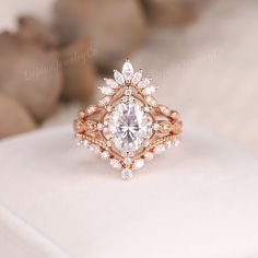 a close up of a diamond ring on a pillow