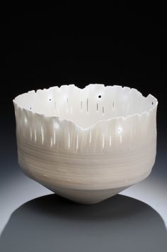 a white bowl sitting on top of a table