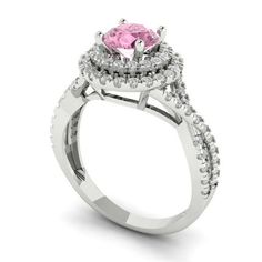 a pink diamond engagement ring with two halos on the side and diamonds around the band