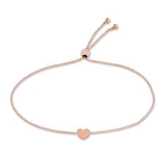 A meaningful heart station shimmers elegantly in the center of this timeless women's bolo bracelet. Fashioned in 14K rose gold, the cable chain secures in place with a bolo clasp. Elegant Heart Bracelet With Adjustable Chain, Classic Adjustable Heart Bracelet For Valentine's Day, Adjustable Classic Heart Bracelet For Valentine's Day, Luxury Adjustable Heart Bracelet, Classic Rose Gold Heart Bracelet For Anniversary, Luxury Rose Gold Heart Bracelet, Elegant Rose Gold Bracelet With Sliding Knot, Minimalist Rose Gold Heart Bracelet With Adjustable Chain, Minimalist Rose Gold Heart Bracelet With Charm