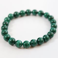 Handmade Malachite bracelet Stunning Malachite stretch bead bracelet. Malachite, known as the stone of transformation, is an incredible healing stone. It acts as the guardian of the heart and helps to instill positivity and optimism. It's a perfect stone for your heart and throat chakra. Materials: A grade Malachite gemstone beads Bracelet Malachite, Malachite Bracelet, Throat Chakra, Healing Stone, The Stone, Bead Bracelet, Healing Stones, The Guardian, Turquoise Bracelet