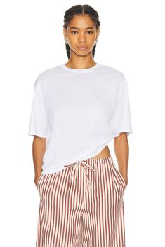 Find SPRWMN Oversized Cropped Boxy Tee on Editorialist. SPRWMN Oversized Cropped Boxy Tee in White 100% cotton. Made in USA. Machine wash. Lightweight jersey fabric. SPRF-WS34. TEE111CTN3. About the designer: Effortless Boxy Crew Neck Top, Relaxed Boxy Fit Tops With Shirttail Hem, Effortless Boxy Fit T-shirt, Effortless Cotton Top With Shirttail Hem, Spring Boxy Fit Tops With Shirttail Hem, Effortless Cotton Shirttail Hem Top, Summer Boxy Fit Top With Shirttail Hem, Effortless Boxy Short Sleeve Top, Spring Top With Boxy Fit And Shirttail Hem