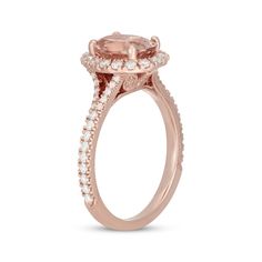 an oval shaped pink morganite and diamond halo engagement ring in 18k rose gold