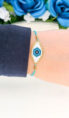 "Handmade Beaded Evil Eye Symbol Bracelet Made with Original Miyuki Beads and 24k gold plated spacer beads \"May every Evil Eye in your life go blind\" Perfect bracelet to keep yourself protected from the Evil Eye!  This is an adjustable bracelet, making it  a great option to gift" Evil Eye Bead Bracelet Gift, Turquoise Beaded Braided Bracelet Gift, Adjustable Evil Eye Beads As Gift, Adjustable Evil Eye Beads For Gifts, Adjustable Beaded Evil Eye Bracelet Gift, Beaded Evil Eye Bracelet For Friendship, Adjustable Friendship Bracelets With Spacer Beads As Gift, Adjustable Beaded Turquoise Evil Eye Bracelet, Adjustable Turquoise Beaded Evil Eye Bracelet