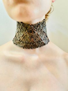 2000 Rare Vintage John Galliano for Christian Dior Choker. Runway Collection, Rare collector's item! Possibly from the Byzantine Collection in 2000. Constructed of diamond shapes hooked together by a loop in the back. The rows of diamonds alternate between cross and flower motifs in the middle. They are embellished with black beads with lovely shine. It closes with three chains on one side and three hooks on the other, Length is adjustable. Made in France. Made of metal and rhinestones. This choker is unreal! Length 10" Width 3.25" Chain length 3.5".  Etsy Shipping Please read -Vintage and pre-owned items may have signs of wear and use and are offered as is. Traces of age and use are therefore completely normal and do not constitute defects. Please see pictures as they are part of the item Designer Formal Jewelry With Intricate Design, Designer Jewelry With Intricate Design For Formal Occasions, Designer Engraved Evening Jewelry, Designer Engraved Jewelry For Evening, Luxury Evening Jewelry With Intricate Design, Luxury Intricate Design Jewelry For Evening, Dior Pearl Choker, Kate Moss John Galliano, Dior Runway 90s