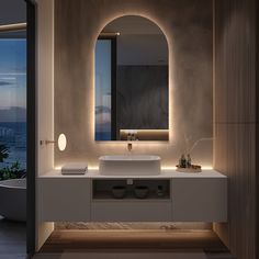 a bathroom with a sink, mirror and bathtub next to a large window overlooking the ocean