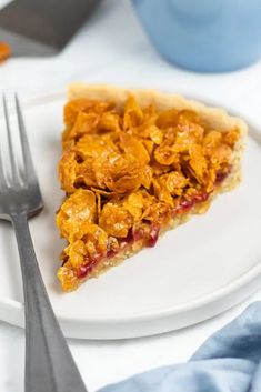 a white plate topped with a slice of pie