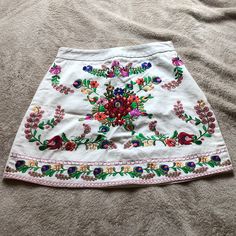 Multi Color Skirt With Delicate Embroidery Excellent Condition Never Worn Size S Spring Embroidered Cotton Skirt, White Skirt With Floral Embroidery, Summer Cotton Skirt With Floral Embroidery, Embroidered Cotton Mini Skirt For Summer, Spring Embroidered Skirt, Summer Floral Embroidered Mini Skirt, Summer Festival Skirt With Floral Embroidery, Spring Bohemian Mini Skirt With Floral Embroidery, Bohemian Mini Skirt With Floral Embroidery For Spring