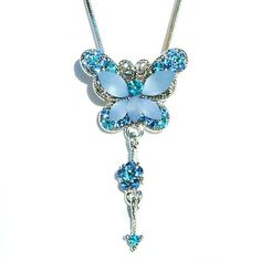 PERFECT CHRISTMAS GIFT FOR Lady!! You are getting an Elegant Swarovski Crystal 2 tone AQUA BLUE BUTTERFLY with flower and a drop Pendant come with a FREE 18" inches (45cm) silver plated rhodium finish snakle chain necklace with lobster clasp.  The chain is removable, so you can put any chain, ribbon or rubber cord through the pendant.Pendant size is 7/8"(2.3cm) wide X 1 5/8" (4.0cm) high.Crystal Color: Aqua & Light Sapphire  ===================Prices are in US$.For shipping policies and othe Blue Jewelry For Christmas Party, Blue Christmas Party Jewelry, Blue Necklace For Christmas Gift, Jewelry Best Friends, Floral Pendant Necklace, Wedding Pendant, Crystal Butterfly, Floral Pendant, Crystal Blue