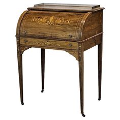 an old fashioned desk with drawers and writing on the top, sitting against a white background