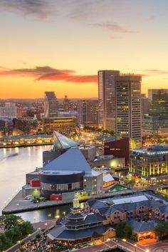 an aerial view of a city at sunset