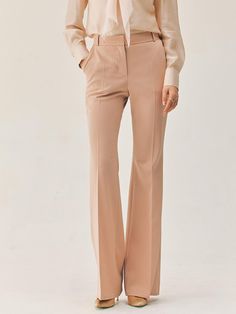 This product features the Vashti bootcut trousers, which are a contemporary update on a classic style. The trousers boast a flattering bootcut silhouette that gently flares from the knee to hem, creating an elongated look. Tailored to perfection, these trousers sit at the natural waist and are designed to offer both comfort and a streamlined appearance. - The bootcut silhouette of these trousers offers a flattering shape that balances proportions and elongates the legs.- Sitting comfortably at the natural waist, they provide a fit that's both secure and stylish.- Tailored construction ensures a polished look, ideal for a professional setting or a sophisticated casual outfit.- These trousers are a versatile staple, easily paired with various tops and shoes for a range of occasions. Elegant Elastane Wide Leg Pants, Elegant Flare Dress Pants For Formal Occasions, Elegant Flare Bottoms For Formal Occasions, Elegant Tailored Flare Pants, Elegant Tailored Flare Bottoms, Elegant Flare Dress Pants For Office, Elegant Tailored Wide Leg Flared Pants, Elegant Flare Bottoms For Workwear, Classic Flare Wide Leg Pants For Business Casual