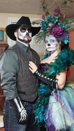 a man and woman dressed up in costumes