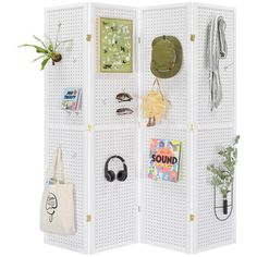 a white room divider with various items on it