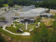 an aerial view of a building surrounded by trees