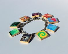 "Don't have time to stroll down the Yellow Brick Road to find an accessory befitting those in the Emerald City? Don't worry, we've got you covered.  Measuring 7.5\" and made from upcycled Scrabble tiles, this charm bracelet is a better find for fans of \"Wizard of Oz\" than a pair of ruby slippers." The Emerald City, Ruby Slippers, Brick Road, Scrabble Tiles, Yellow Brick Road, Wizard Of Oz, Green Bead, Charm Bracelets, Black Beads