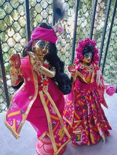 This is a set of radha krishna poshak. It includes 1 lehenga and 1 dupatta for radhaji and a dhoti with patka for krishnaji. Pink Dabka Sets For Festivals, Multicolor Lehenga With Dabka For Navratri, Traditional Drape Sets For Puja And Festivals, Pink Traditional Drape Festival Set, Multicolor Dabka Traditional Wear For Puja, Bollywood Sets With Pallu For Puja, Multicolor Dabka Sharara For Festivals, Pink Sets For Puja And Diwali, Bollywood Style Sets With Pallu For Puja