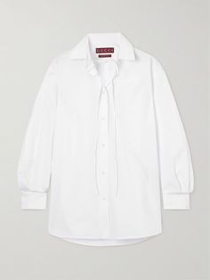 There's always more than first meets the eye in Gucci's wardrobe essentials - look closely at the shirt and you'll see the brand's logo embossed at the collar. It's made from heavyweight cotton-poplin in an oversized shape and has dainty ties at the neckline. Gucci Blouse, Dr Wardrobe, Oversized White Shirt, Gucci Shirt, Sport Swimwear, Cotton Poplin Shirt, Knitwear Tops, Jeans Jumpsuit, Poplin Shirt