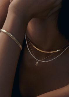 This classic tennis necklace features 2mm natural round diamonds four-prong set in 14k gold. Make a statement and wear Diana without anything else.This piece is made to order. Please allow at least 10-15 business days for production. This piece is only eligible for exchange or store credit. 14k solid gold—always Weight: 14.5g Width: 2.18mm Carat weight: 6.20ctw Diamond color: G Diamond clarity: VS2 SI1 Box clasp with safety Tennis Necklace Diamond, Stacked Wedding Rings, Diamond Tennis Necklace, Herringbone Chain, Herringbone Necklace, Necklace Diamond, Tennis Necklace, Band Bracelet, Broken Chain