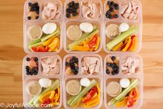 several plastic containers filled with different types of food