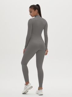 Why We Love It: The Hannah Long Sleeve Zipper Bodysuit is the epitome of sleek, modern activewear. This bodysuit combines functionality with a streamlined design, ensuring you look and feel your best whether you're at the gym or out and about. Fit and Features: Front Zipper Detail: The front zipper allows for easy wear and adjustability, adding a chic element to this versatile piece. Long Sleeves with Thumbholes: Provides added coverage and a secure fit, perfect for cooler weather or intense workouts. Buttery Soft Fabric: This bodysuit feels like a second skin, offering unmatched comfort and flexibility. High Performance: The four-way stretch material ensures maximum freedom of movement, making it ideal for any activity. Moisture-Wicking Technology: Keeps you dry and comfortable, no matter Compressive Unitard With Thumbholes, Compressive Solid Unitard With Thumbholes, Compression Elastane Unitard For Gym, High Stretch Elastane Unitard For Gym, Functional Stretch Unitard In Color, Sporty Solid Color Unitard, Compressive Elastane Unitard For Sports, Athleisure Elastane Unitard For Pilates, Solid Color Sporty Elastane Unitard