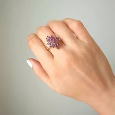 This vintage piece features a beautiful Marquise shaped Amethyst cluster set in 14K Yellow Gold. The Amethyst stones make up approximately 1 carat total weight and the ring weighs 4 grams. An eye-catching and timeless addition to any jewelry collection. Size 7 sizing available with fee contact us to have it added to the price before checkout.Thank you for visiting our shop!Visit our website DmKJewelry.comAlso Follow us on Instagram https://www.instagram.com/dmkjewelryny/ 14k Gold Birthstone Cluster Ring, Heirloom Cluster Ring Gift, 14k Gold Cluster Ring With Birthstone, Purple Cluster Ring With Accent Stones, Cluster Ring With Accent Stones For Gift, Pink Cluster Ring With Gemstone, Pink Cluster Gemstone Ring, Purple Multi-stone Cluster Ring For Anniversary, Elegant Purple Multi-stone Cluster Ring