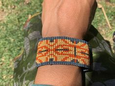 Handmade bracelet from Peru, keep the energy of nature with you. Made by Toho11/0 seed beads and leather. Festival Bracelets, Parrot Feather, Huichol Art, Blue Leaves, Handmade Bracelet, Single Earring, Beads Bracelet, The Energy, Handmade Bracelets