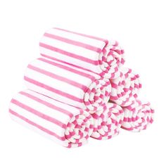 pink and white striped towels stacked on top of each other