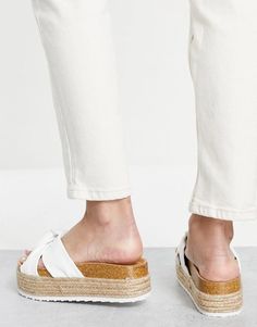 Free your feet in this stylish flatform sandal from ASOS DESIGN, featuring knotted straps and a peep toe silhouette. The Teegan sandals boast a flatform rope sole for a playful twist on the classic slip-on style, perfect for pairing with bohemian dresses and denim cut-offs. At just $39, versatile white is a must-have for summer snaps and effortless outfit inspiration - simply untie the knots and slip them on for lightweight comfort wherever the day takes you. White Sandals With Textured Sole For Spring, White Open Toe Platform Slippers With Textured Footbed, Spring White Sandals With Textured Sole, White Platform Slippers With Textured Footbed For Spring, White Open Toe Wedge Sandals With Textured Sole, Trendy White Wedge Sandals With Textured Footbed, Summer Snaps, Bohemian Dresses, Effortless Outfit