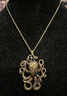 Necklace is antique bronze in color Measures 18 inches in length Pendant measures 3 inches in length and 2 inches in width Steampunk Octopus, Octopus Necklace, Hippie Necklace, Small Gift Bags, Bronze Pendant, Ring Photos, Antique Bronze, Octopus, Pendant Necklaces