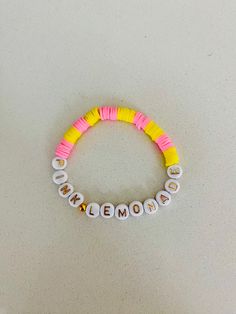 If you like summertime🏖️here's a pink lemonade bracelet Personalized Yellow Casual Bracelet, Casual Yellow Personalized Bracelet, Casual Yellow Bracelets With Letter Beads, Cute Personalized Yellow Bracelets, White Fun Bracelets For Vacation, Fun White Bracelets For Vacation, Fun Vacation Jewelry With Letter Beads, Fun Beaded Stretch Bracelet For Summer, Fun Letter Beads Jewelry For Vacation