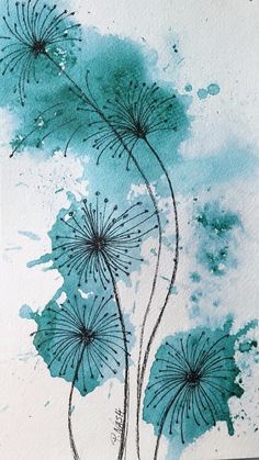 watercolor painting of blue flowers on white paper with green paint splattered in the background