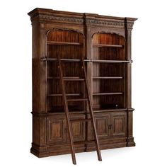 a large wooden bookcase with two ladders next to it