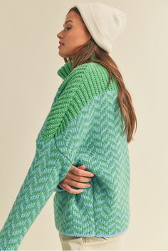 Stay warm and look great with this cozy Alpine Chevron Turtle Neck Sweater! Made from a chevron knit fabric in cool ocean tones of blue and green, ribbed turtle neck, drop sleeves, and an oversized fit, this cute sweater looks as good as it feels. Snuggle in style! Color: Blue & Green Ribbed Turtle Neck Drop Shoulder Long Sleeves Waist Length Acrylic Cozy Green Textured Knit Sweater, Green Funnel Neck Sweater For Fall, Spring Casual Chunky Knit Turtleneck, Casual Spring Chunky Knit Turtleneck, Casual Chunky Knit Turtleneck For Spring, Trendy Chunky Knit Turtleneck, Trendy Green Turtleneck Sweater, Green Casual Turtleneck For Fall, Casual Green Turtleneck For Fall