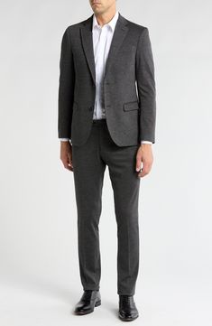 Clean lines and simple details yield a refined appearance in this elegant suit that's tailored in a slim fit. Jacket has front button closure; notched lapels; four-button cuffs; front flap pockets; chest welt pocket Lined 70% nylon, 24% polyester, 4% spandex, 2% other fibers
 Dry clean Imported Single Button Slim Fit Suit For Business Casual, Slim Fit Single Button Business Casual Suit, Business Casual Pantsuit With Pressed Crease, Single Button Tuxedo Suit For Work, Slim Fit Business Casual Suit With Hidden Buttons, Modern Suit For Office, Sleek Notch Lapel Suit For Office, Sleek Notch Lapel Suits For Office Wear, Tailored Suits With Lapel Collar For Office Wear