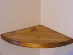 a wooden shelf hanging on the wall