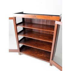 a wooden shelf with two open shelves on one side and three closed shelves on the other