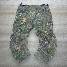 "Vintage Mossy Oak Hunting Camo Tactical Pants Field Staff Baggy Fit Cargos Crazy Woodland Pattern 90s Skate / Streetwear Great Condition: 9/10 Men's Size:  Waist: 42\" Length (inseam): 32\" Leg Opening: 9\" Thigh Opening: 15\" Front Rise: 14.5\"" Baggy Combat Pants For Outdoor, Baggy Camouflage Bottoms For Outdoor, Military Style Long Outdoor Pants, Military Style Baggy Cargo Pants For Outdoor Activities, Military Style Outdoor Long Pants, Military Style Long Pants For Outdoor, Baggy Military Cargo Pants For Outdoor Activities, Combat Style Bottoms With Cargo Pockets For Outdoor Activities, Military Style Baggy Bottoms For Outdoor Activities