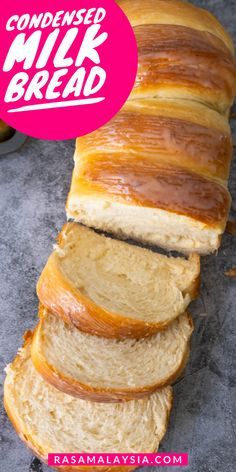 a loaf of bread is sliced and sitting on a table with the words condenseed milk bread above it