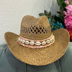 This coastal cowgirl hat has bright coral fabric with gold details and shells. A coastal cowgirls dream! All hats are around 22-24 inches inside but come with an adjustable string that can tighten the hat inside. Check out my Instagram @delisico *PLEASE MESSAGE ME IF YOU NEED FOR A SPECIFIC DATE. BIRTHDAY, CONCERT, EVENT* Women In Cowboy Hats, Gold Straw Hat For Beach With Short Brim, Gold Short Brim Sun Hat For Beach, Gold Fedora Straw Hat For The Beach, Pink Bohemian Straw Hat For Beach Season, Bohemian Pink Sun Hat For Beach Season, Pink Bohemian Sun Hat For Beach Season, Gold Brimmed Sun Hat For Beach, Gold Brimmed Straw Hat For The Beach