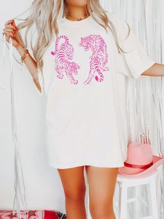 Express the Pink Tiger Aesthetic with this cute Vintage Tiger Shirt! This Graphic Comfort Colors® Tshirt is super soft and comfy! Size up for a Trendy Oversized Look! SHIPS FREE! SIZING TIPS: Size up 2-3 sizes from your "usual size" to get the "Oversized" Look! (2 sizes up is most common, and 3 sizes up is more dramatic) For a "relaxed fit" order your "usual size". When in doubt, lay your favorite fitting Tee flat and measure armpit to armpit and compare the width against the Size Chart in the p Tiger Aesthetic, Pink Tiger, Vintage Tiger, Tiger Shirt, Comfort Colors Tshirt, Etsy Ideas, Simple Tshirt, Summer 24, Mini Dresses