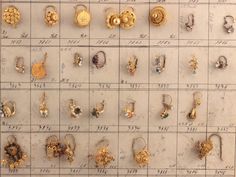 many different types of earrings are on display