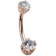 a rose gold belly ring with an oval crystal stone